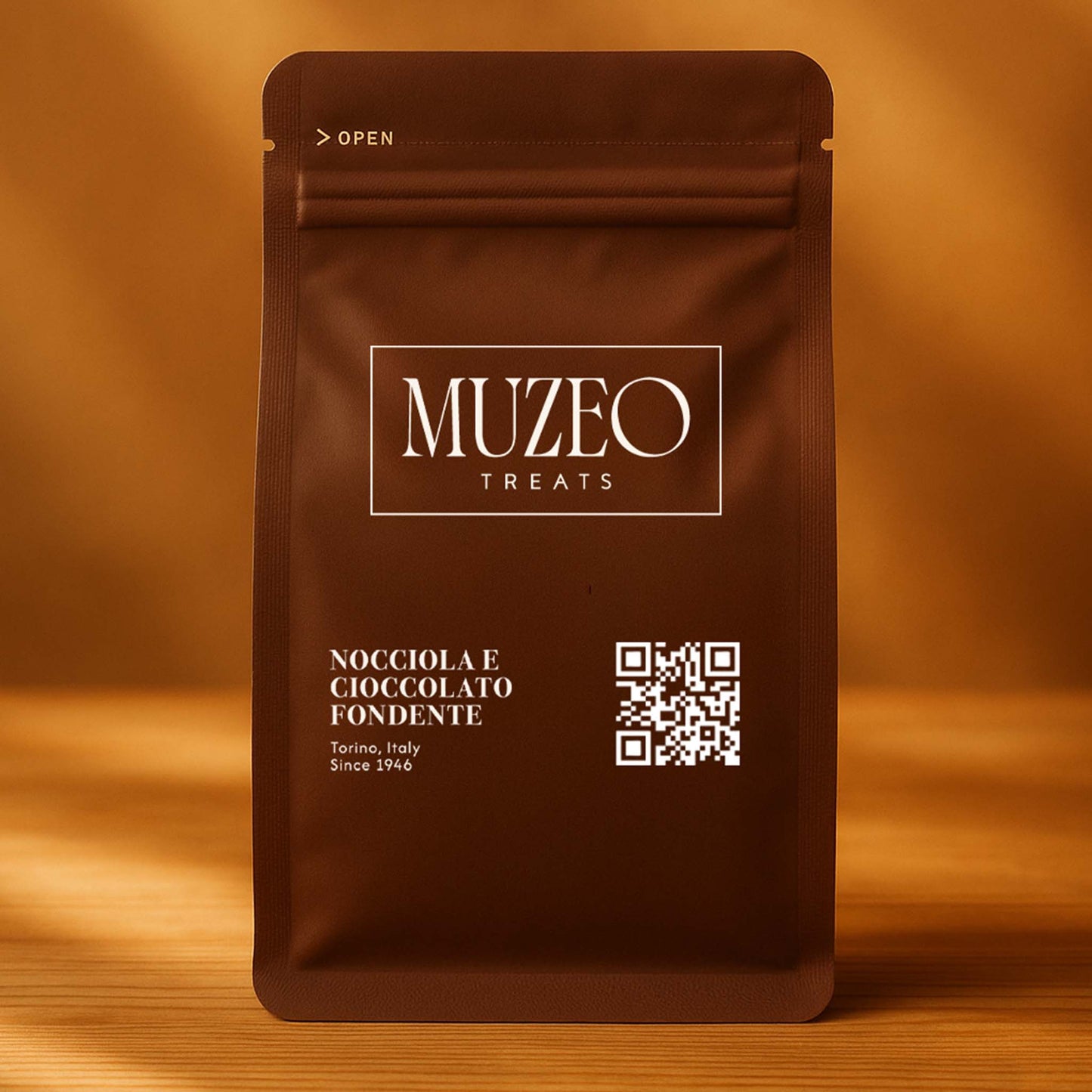 <div style="text-align: center;"> <span style="color: #1D1919;"> Nocciola e cioccolato fondente (3.5 oz.)</span><br><span style="color: #444444;">Torino, Italy </span> <br> <span style="color: #444444;">Pouch Dims. 6.0" × 3.5" × 2.15"</span> </div>