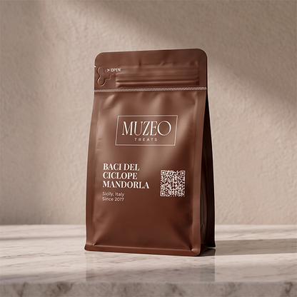 <div style="text-align: center;"> <span style="color: #1D1919;">Baci del Ciclope Mandorla (3.5 oz.)</span><br><span style="color: #444444;">Sicily, Italy</span> <br> <span style="color: #444444;">Pouch Dims. 6.0" × 3.5" × 2.15"</span> </div> 