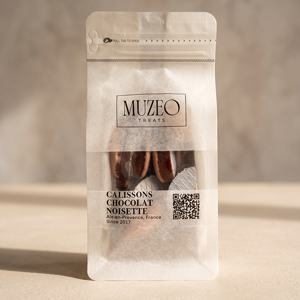 <div style="text-align: center;"> <span style="color: #1D1919;"> Calissons Chocolat Noisette (5 oz.)</span><br><span style="color: #444444;">Aix-en-Provence, France</span> <br> <span style="color: #444444;">Pouch Dims. 7.5" x 3.5" x 2.15"</span> </div> 